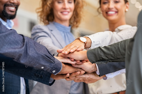 Group of multiethnic business people stacking hands photo