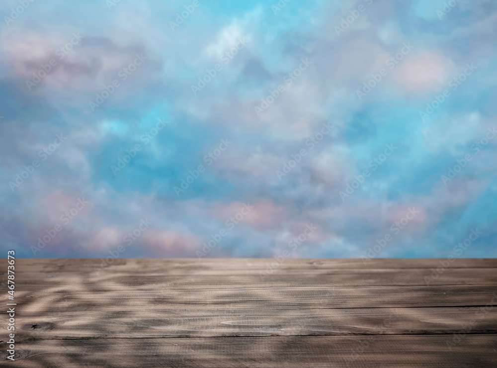 Empty table top for product presentation against sky background