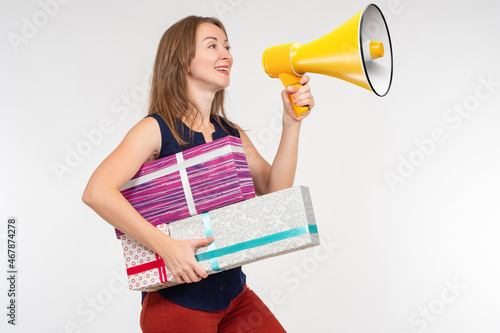 Woman with loudspeaker. Gir...