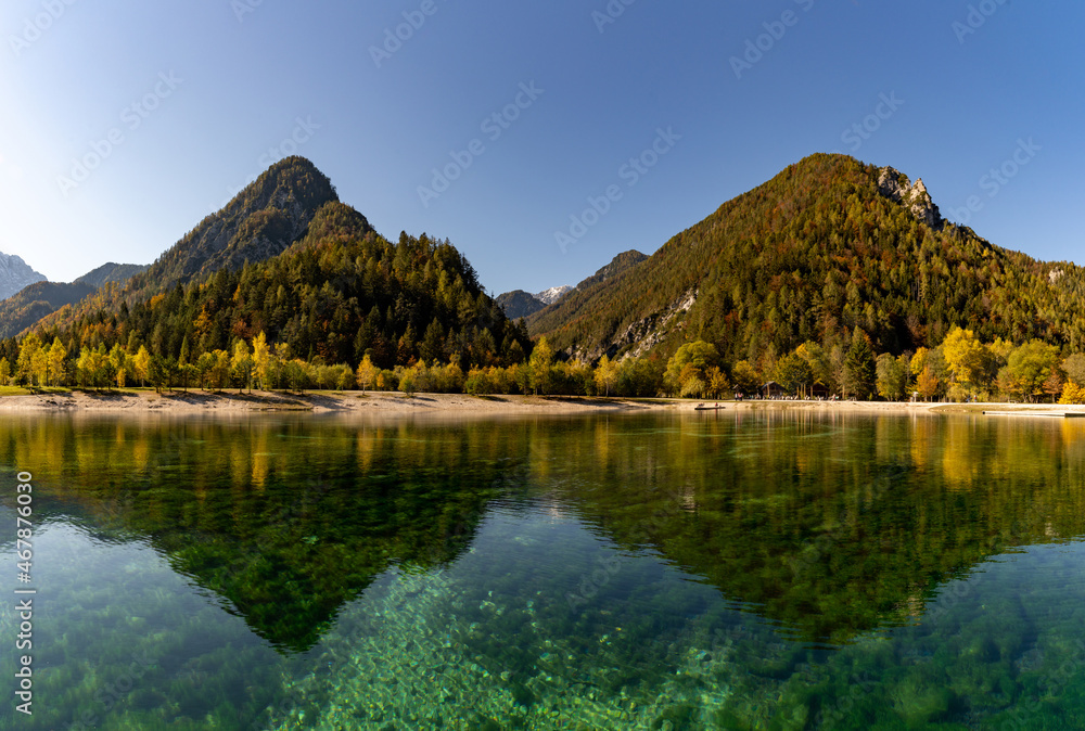 view of Lake Jasna with forest and mountain landscape in beautiful autumn colors