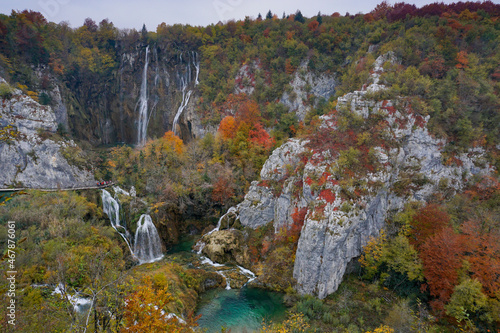 view of the great waterfalls in Plitivice with vibrant and colorful fall color foliage photo