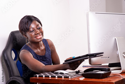 young businesswoman giving a digital tablet in the office smiling.