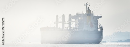 Canvas Print Large blue bulk carrier (ship) sailing in the Baltic sea to Riga port, Latvia
