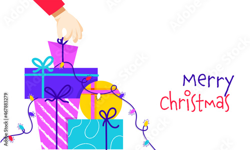 Merry Christmas Font With Colorful Gift Boxes And Lighting Garland On White Background.