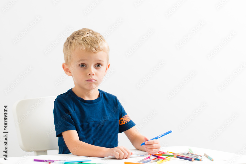 a little boy collects a children's designer from metal a little boy collects a children's designer from metal