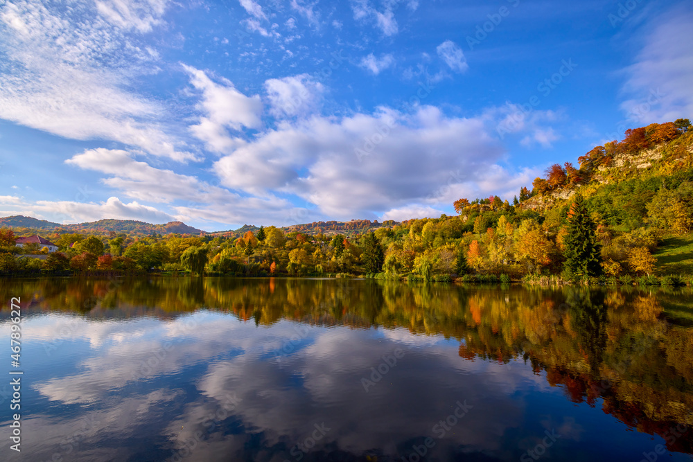 landscape with a mountain lake in autumn on a sunny day