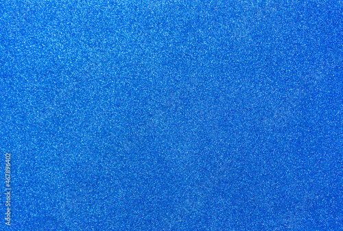 Blue background with sequins. Blue foamiran with a grainy texture. 