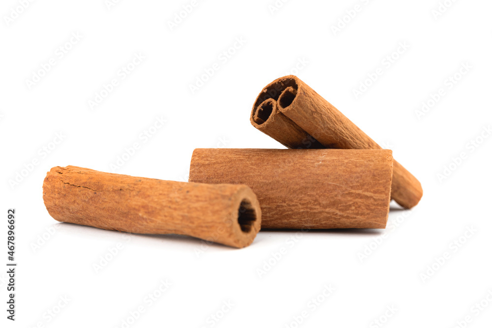 Three cinnamon sticks isolated on a white background photo Three cinnamon sticks isolated on a white background photo