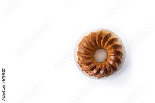 Traditional bundt cake with raisins isolated on white background. Copy space