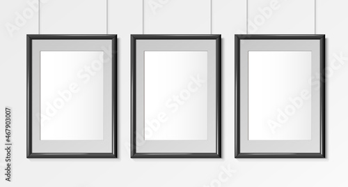 Three Realistic Black Vertical A4 frames. Posters on wall Mock-up. Frames Design Template for Mockup. Vector illustration