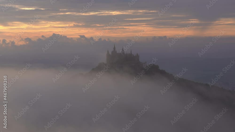 Aerial: Beautiful Shot Of Castle On Mountain In Forest, Drone Flying Over Dramatic Clouds During Sunset - Hohenzollern Castle, Germany Aerial: Beautiful Shot Of Castle On Mountain In Forest, Drone Flying Over Dramatic Clouds During Sunset - Hohenzollern Castle, Germany