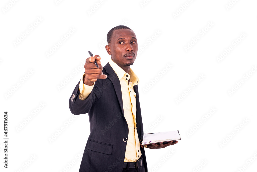 serious young teacher during a classroom lesson pointing finger forward. serious young teacher during a classroom lesson pointing finger forward.