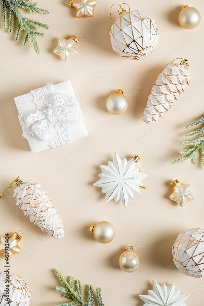 Christmas flat lay composition. Boho style balls, stars, pine cones decorations on beige background. Christmas flat lay composition. Boho style balls, stars, pine cones decorations on beige background.
