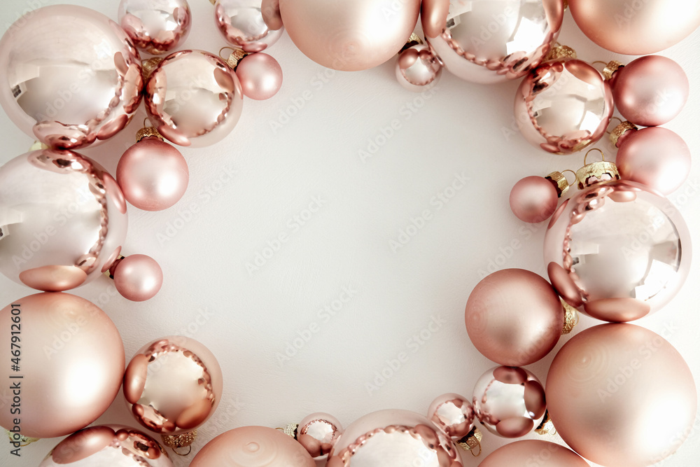 Pink Christmas baubles decoration on white background with copy space. Merry Christmas and Happy New Year greeting card. Minimal style. Flat lay, top view. Pink Christmas baubles decoration on white background with copy space. Merry Christmas and Happy New Year greeting card. Minimal style. Flat lay, top view.