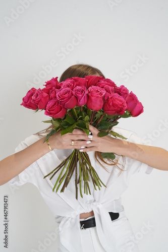 Girl holding pink roses