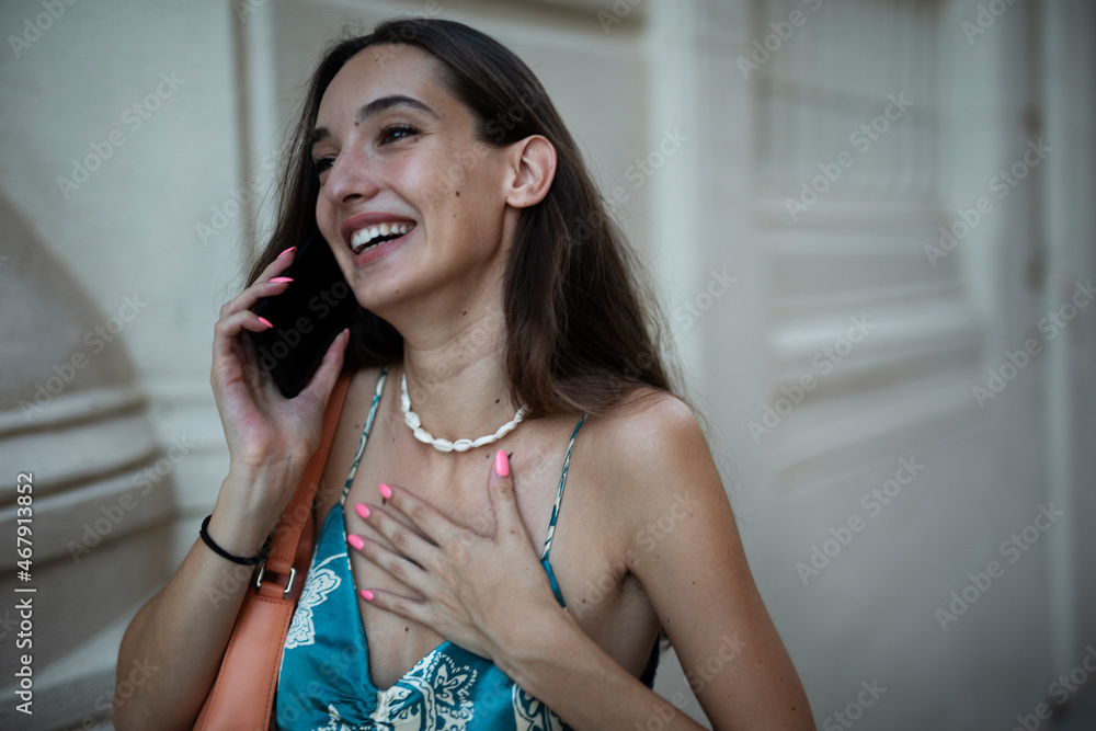 Fototapeta premium Beautiful young elegance woman using the phone. Beautiful fashion woman talking to the phone..