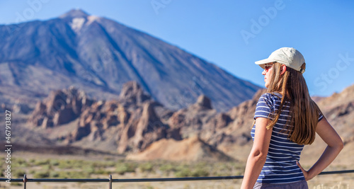 Young tourist woman looking at volcano Teide on Tenerife, Spain.