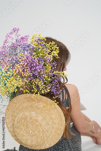 Girl with hat and flowers
