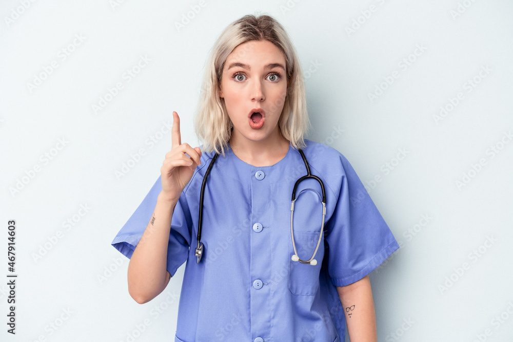 Young nurse woman isolated on blue background having an idea, inspiration concept. Young nurse woman isolated on blue background having an idea, inspiration concept.