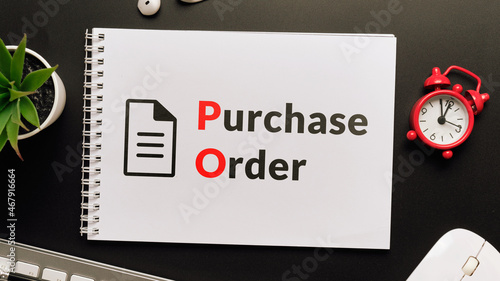 Business acronym PO or Purchase Order. Notepad with inscriptions on the desktop