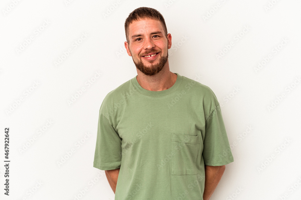 Obraz premium Young caucasian man with diastema isolated on white background happy, smiling and cheerful.