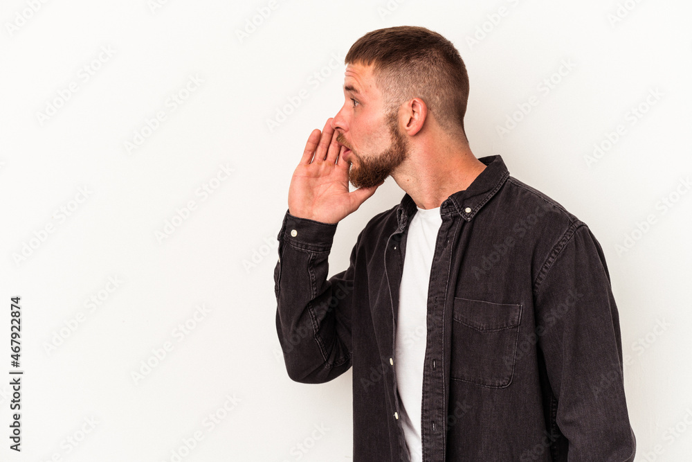 Young caucasian man with diastema isolated on white background is saying a secret hot braking news and looking aside Young caucasian man with diastema isolated on white background is saying a secret hot braking news and looking aside