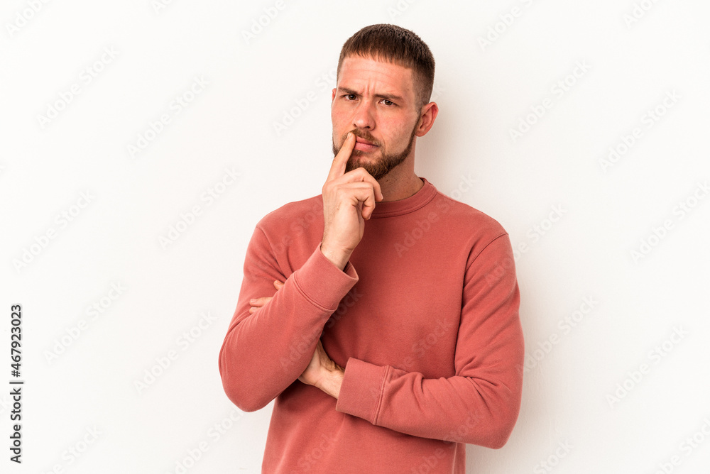 Young caucasian man with diastema isolated on white background unhappy looking in camera with sarcastic expression. Young caucasian man with diastema isolated on white background unhappy looking in camera with sarcastic expression.