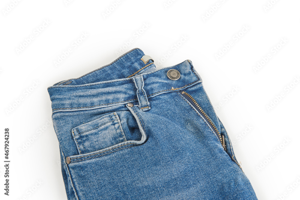 Blue jeans button isolated on the white background, folded, trendy, stylish, fashionable denim. Blue jeans button isolated on the white background, folded, trendy, stylish, fashionable denim.