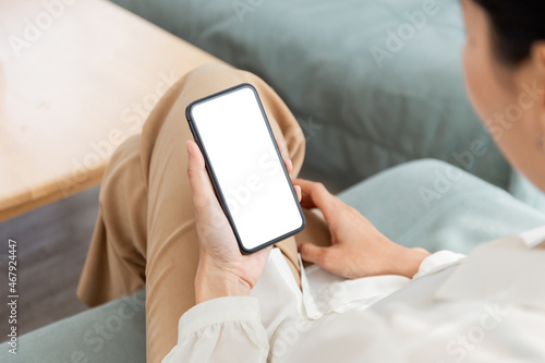 cell phone blank white screen mockup.hand holding texting using mobile on desk at office.background empty space for advertise.work people contact marketing business,technology