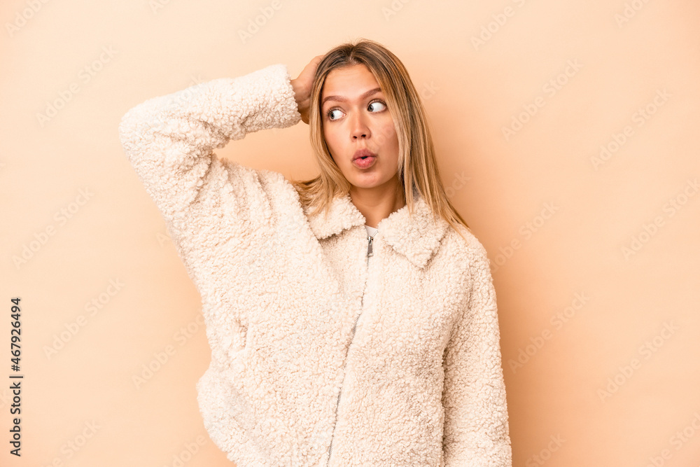 Young caucasian woman isolated on beige background being shocked, she has remembered important meeting. Young caucasian woman isolated on beige background being shocked, she has remembered important meeting.