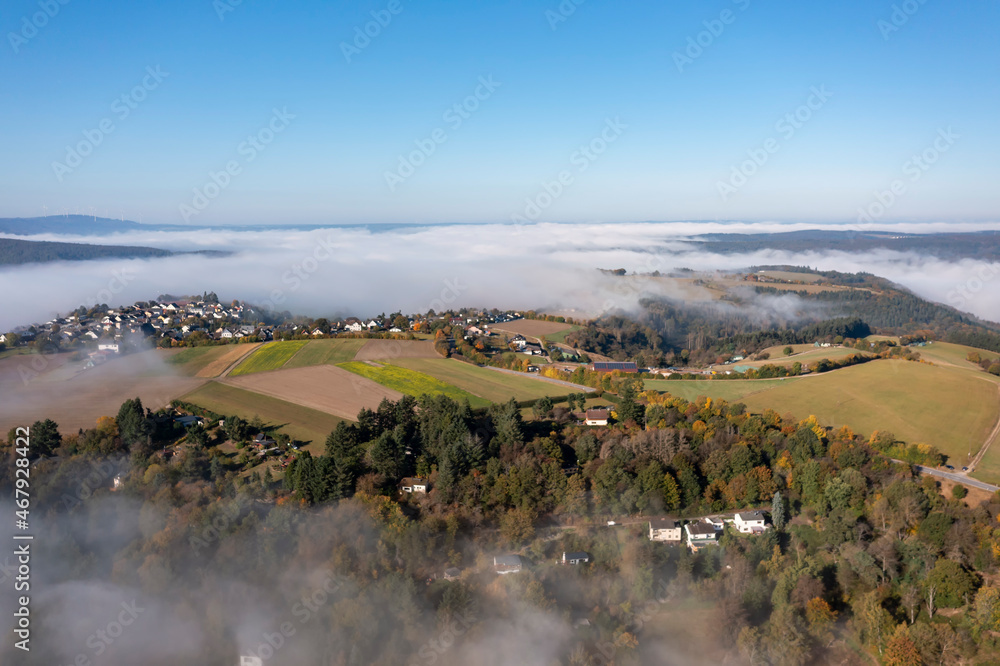 Early morning bird's eye view of the fog-shrouded Wispertal / Germany 