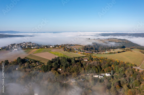 Early morning bird's eye view of the fog-shrouded Wispertal / Germany  photo