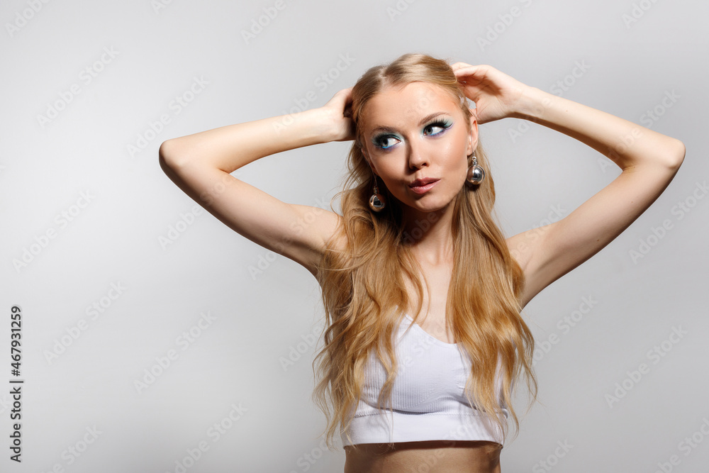 portrait of a model with winter makeup trendy on a gray background portrait of a model with winter makeup trendy on a gray background