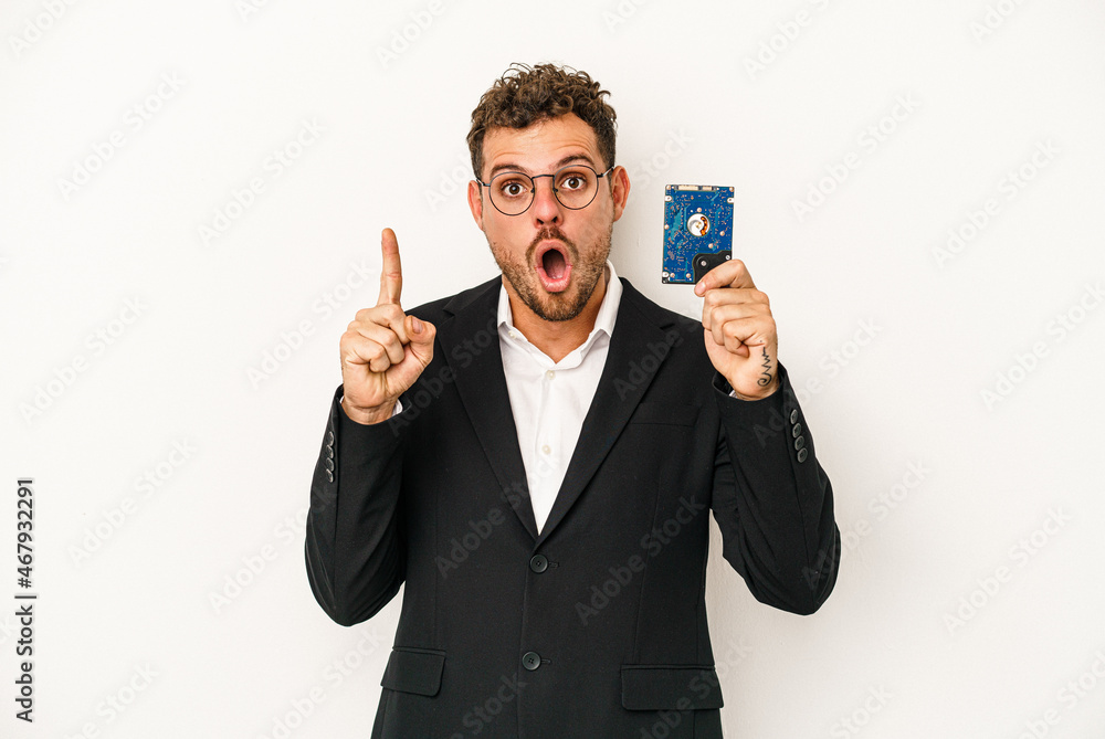 Young caucasian computerized holding HDD isolated on white background having some great idea, concept of creativity. Young caucasian computerized holding HDD isolated on white background having some great idea, concept of creativity.