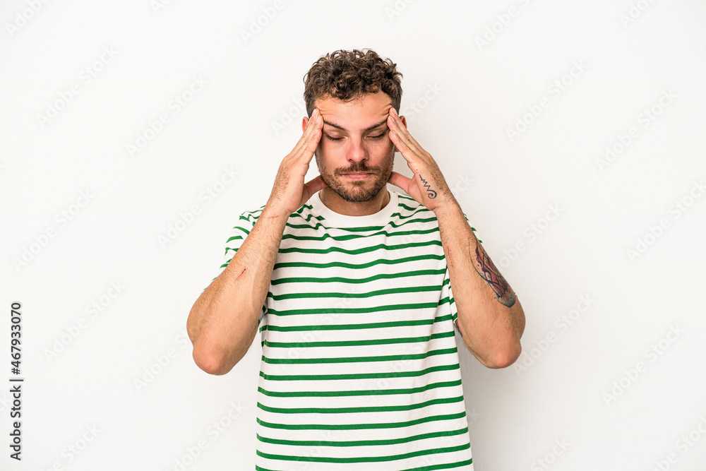 Young caucasian man isolated on white background touching temples and having headache. Young caucasian man isolated on white background touching temples and having headache.