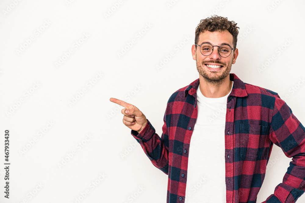Young caucasian man isolated on white background smiling cheerfully pointing with forefinger away. Young caucasian man isolated on white background smiling cheerfully pointing with forefinger away.