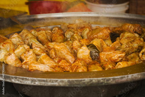 Traditional Balkan winter dish -  cabbage rolls filled with minced meat, rice, fried onion and carrot called sarma photo