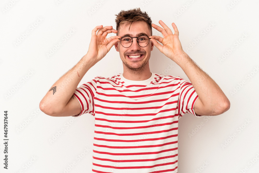 Young caucasian man isolated on white background keeping eyes opened to find a success opportunity. Young caucasian man isolated on white background keeping eyes opened to find a success opportunity.