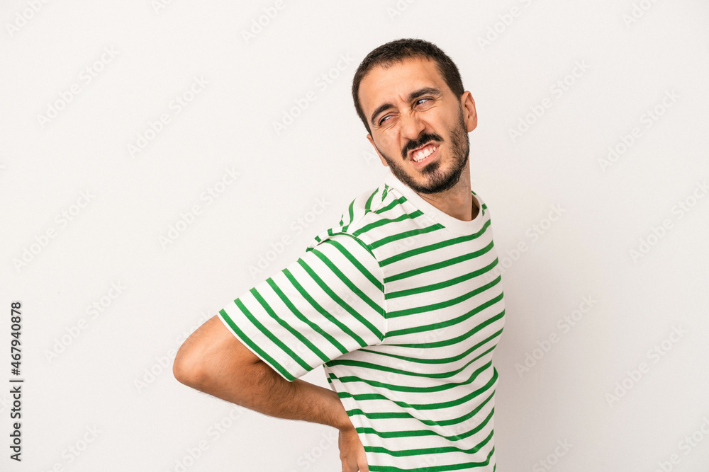 Young caucasian man isolated on white background suffering a back pain. Young caucasian man isolated on white background suffering a back pain.