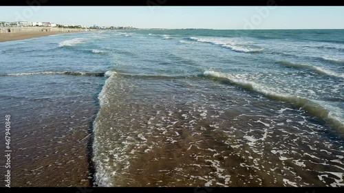 Wavy sea on the coast of the Mediterranean. Antalya beaches with golden sand and clean sea.