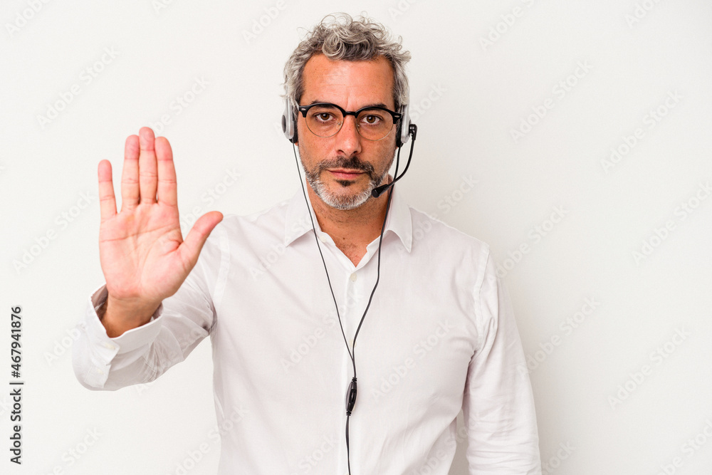 Middle age telemarketer caucasian man isolated on white background standing with outstretched hand showing stop sign, preventing you. Middle age telemarketer caucasian man isolated on white background standing with outstretched hand showing stop sign, preventing you.