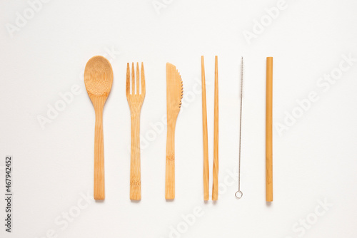 Eco friendly kitchen items . Zero waste and plastic free concept. Forks  knife and spoon in top view on white background. Disposable tableware. Natural products for recycle .