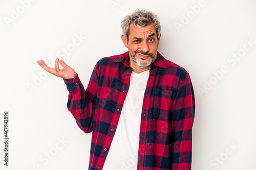 Middle age caucasian man isolated on white background doubting and shrugging shoulders in questioning gesture.