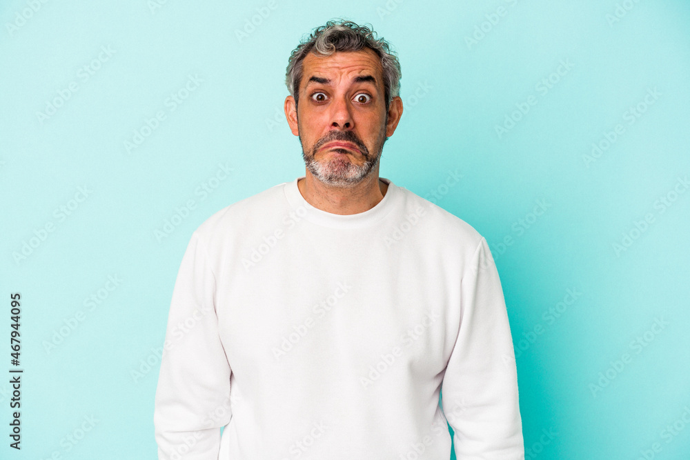 Middle age caucasian man isolated on blue background sad, serious face, feeling miserable and displeased. Middle age caucasian man isolated on blue background sad, serious face, feeling miserable and displeased.