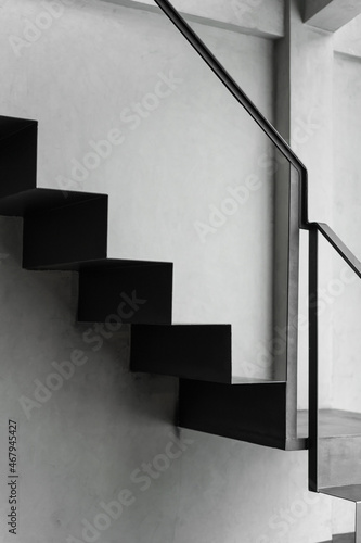 Stairway with black metal structure banister building architecture loft-style railings interior design contemporary.