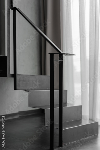 Stairway with black metal structure banister building architecture loft-style railings interior design contemporary.