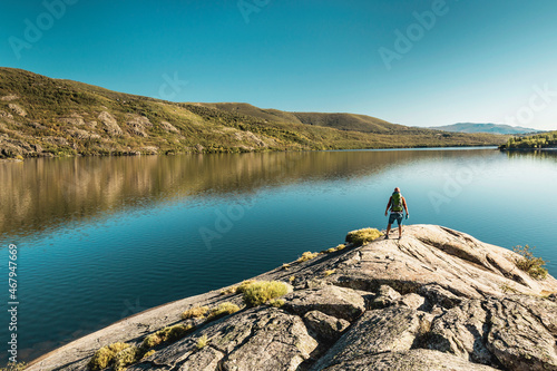 Man hiking near a beautiful lake