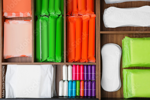 Photography Storage of different feminine hygiene products in wooden organizers, top view