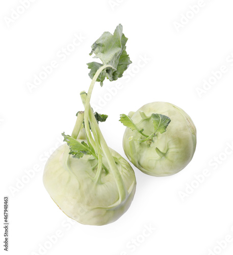 Whole ripe kohlrabies with leaves on white background, top view