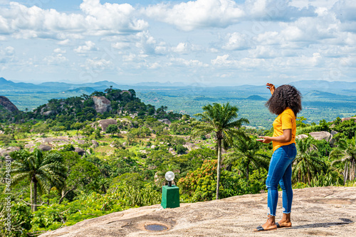 african girl looking at a beautiful nature scenery